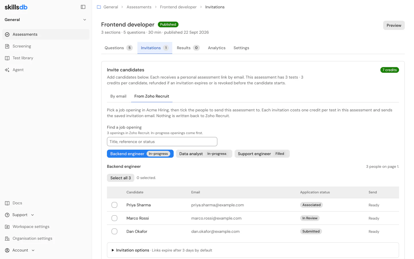 The Invitations tab of a SkillsDB assessment with the From Zoho Recruit tab open, a job opening chosen, and the applications under it listed with the candidate name, the email address, the application status in Recruit and whether the assessment has already gone to that address